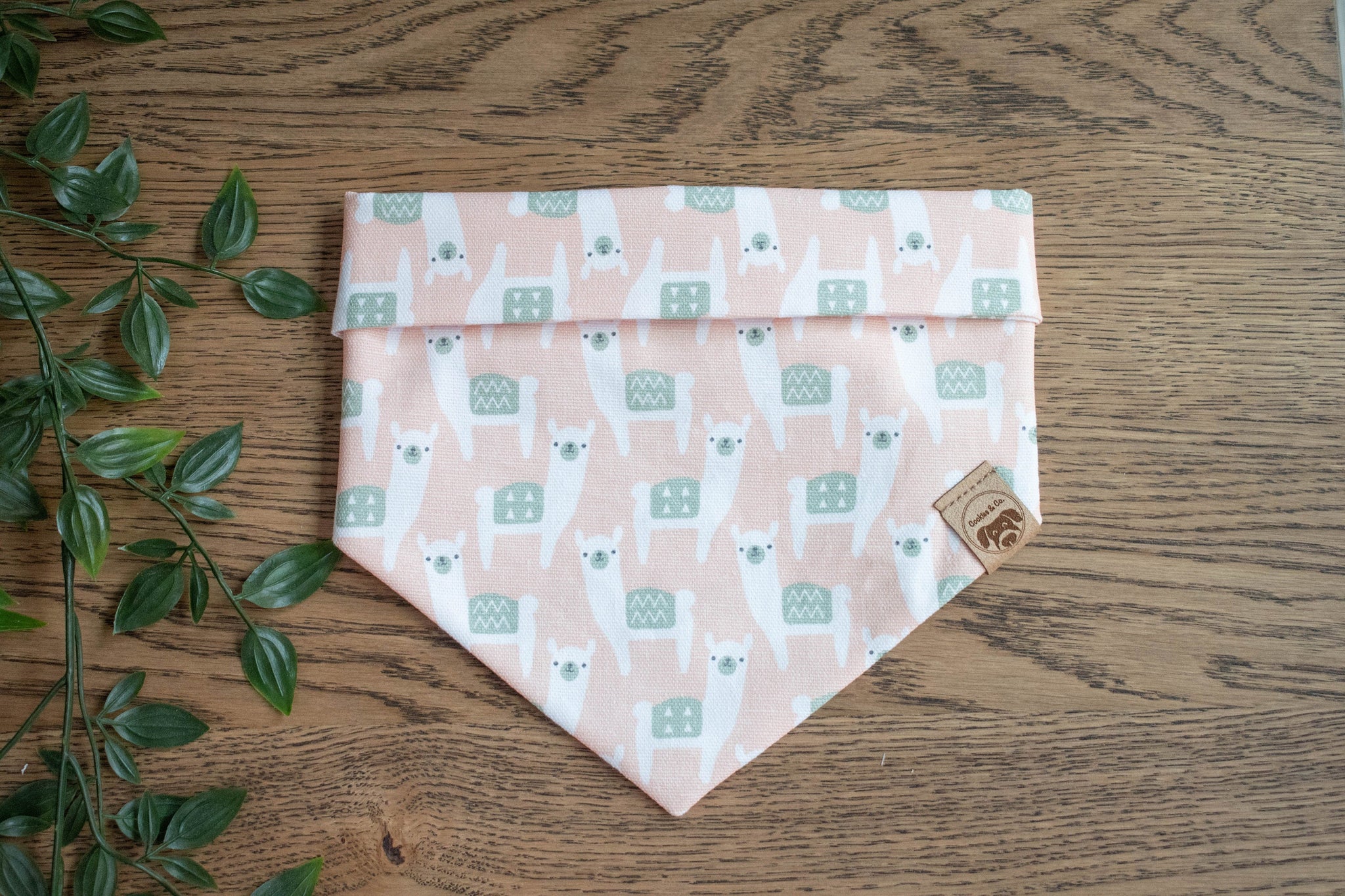 Pack'a Alpacas bandana print, featuring rows of alpacas closely packed, with head turned facing forward