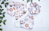 Pupkin Spice Latte bandana print, with pumpkin spice lattes, frappucinos, coffees, donuts, and ferns in light orange tones on a white background. Group set, with matching scrunchie and mask